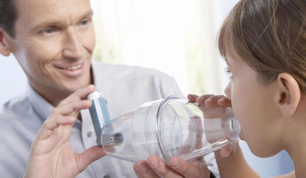 Pediatric Patient Using Asthma Inhaler