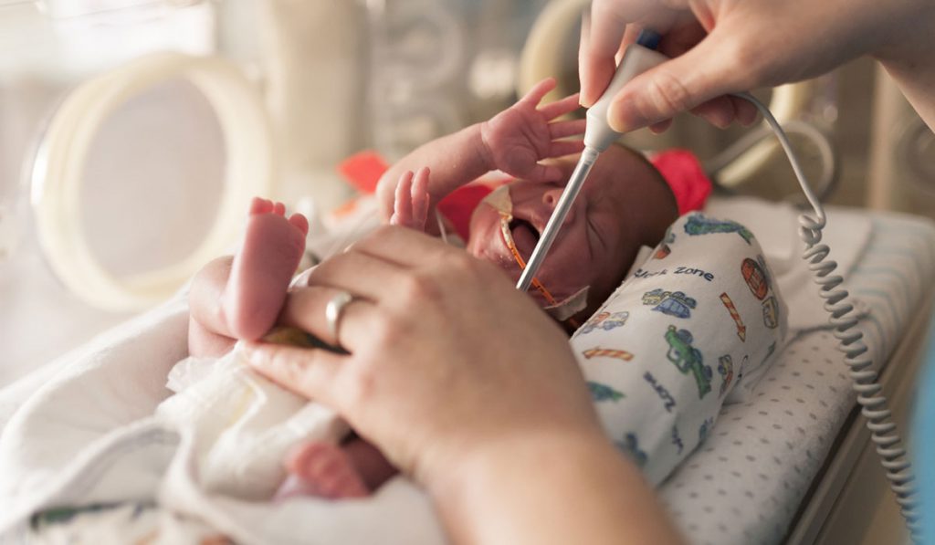 Premature Infant with Caregiver