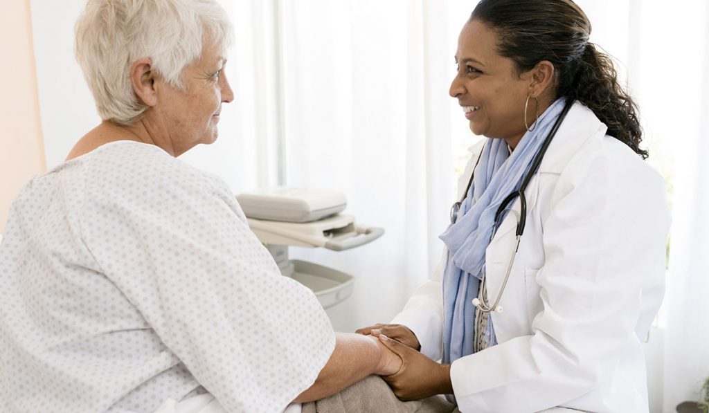 Stock photo of doctor and older patient