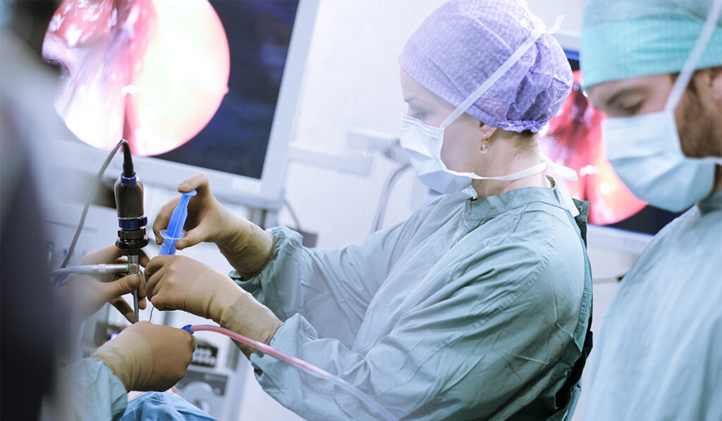 Surgeons operating with exoscopes