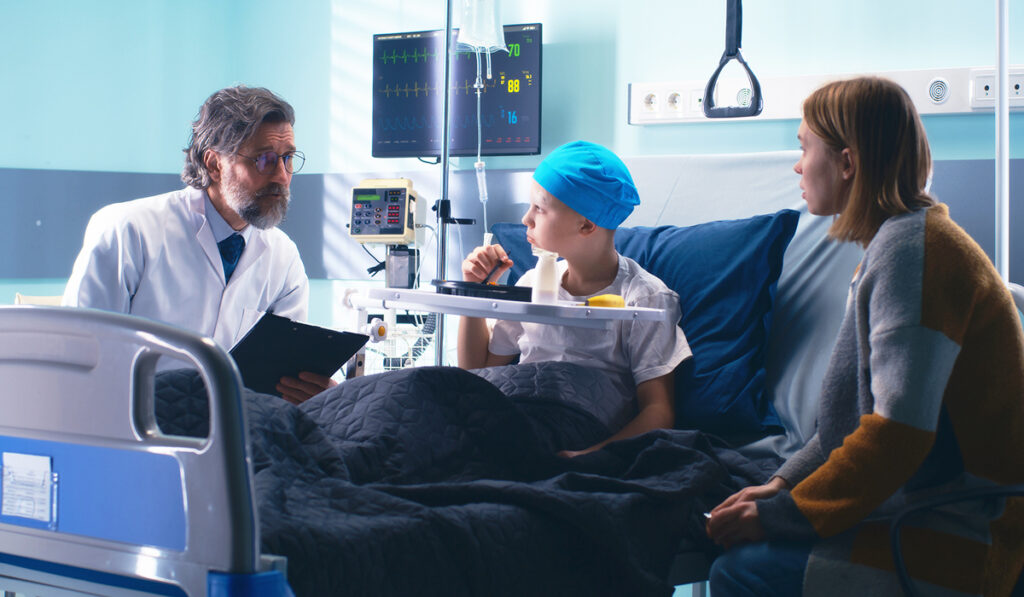 Doctor talking to cancer patient and family