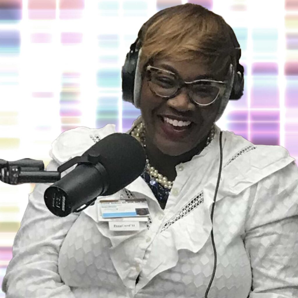 Crystal Jackson wearing headphones and speaking into a microphone