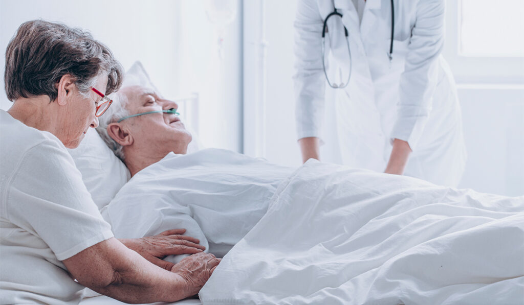 Doctor with dying patient