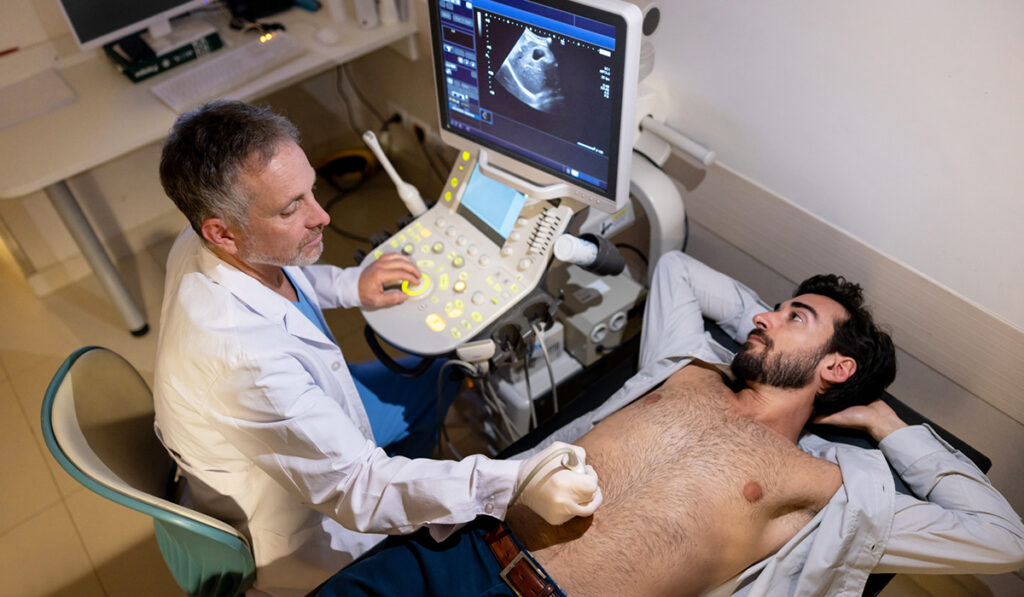 Doctor giving ultrasound to man