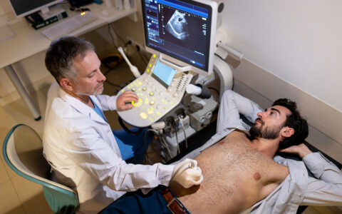 Doctor giving ultrasound to man
