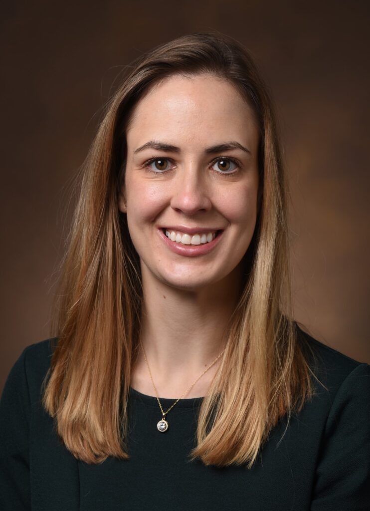 Portrait of Dr. Lauren Klein, a white woman with blond hair in a black shirt