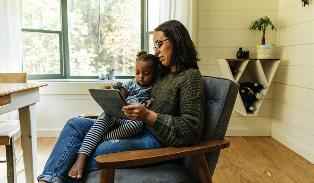 Mom and child using tablet for telehealth consult