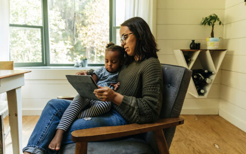 Mom and child using tablet for telehealth consult