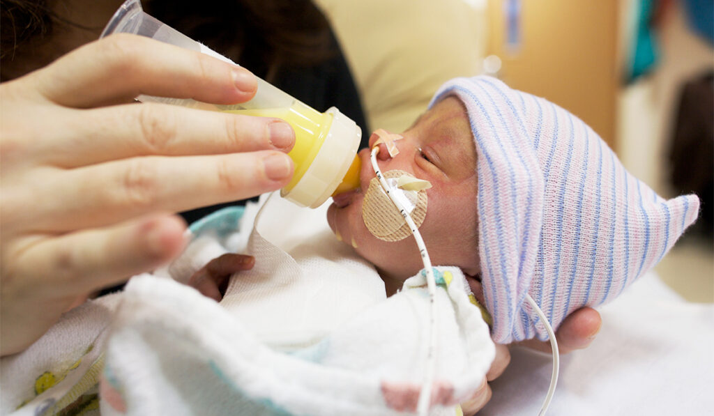Feeding breast milk in bottle to premature infant