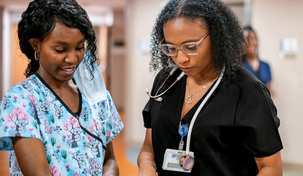 Nurses reading over charts together