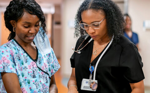 Nurses reading over charts together