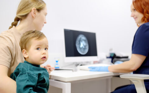 Toddler boy with his mom at neuro appointment