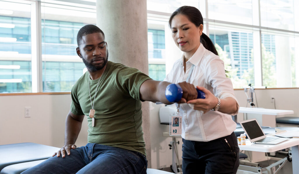 injured soldier in physical therapy